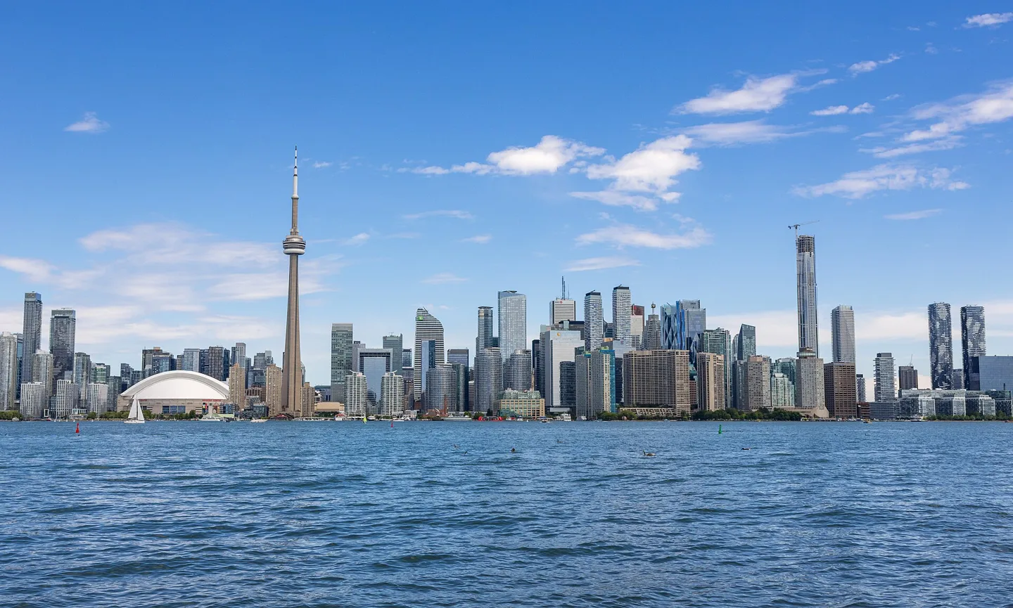 Toronto skyline and CN Tower viewed across Lake Ontario from Olympic Island